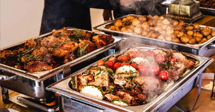 Full-service buffet catering with hot entrees, roasted meats, vegetables, and sides for parties and large gatherings in Columbus Ohio.