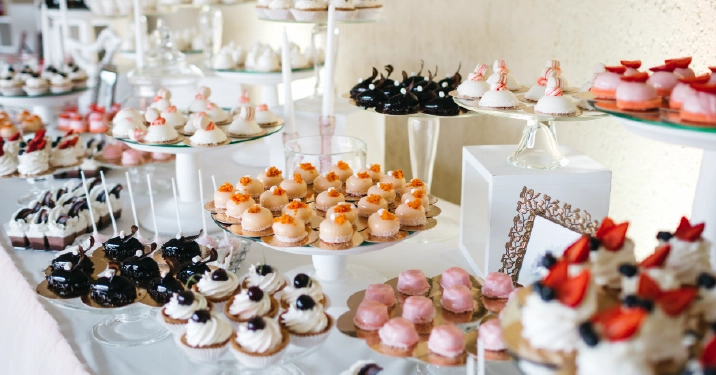 Dessert catering display with mini pastries, cupcakes, and sweet treats for weddings, parties, and corporate events in Columbus Ohio