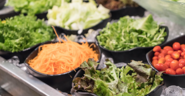 Graduation lunch catering spread with fresh salad ingredients, vegetables, and toppings, ideal for midday open house celebrations in Columbus