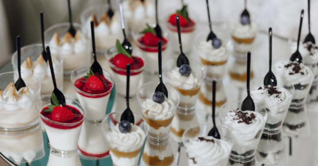 Assorted individual dessert cups and sweet treats served at a graduation party, showcasing appetizer and dessert catering options from Event Thyme Catering in Columbus